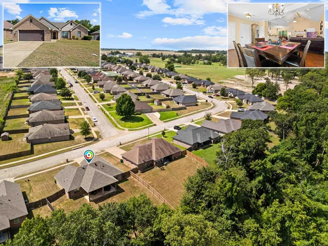 an aerial view of residential houses with outdoor space