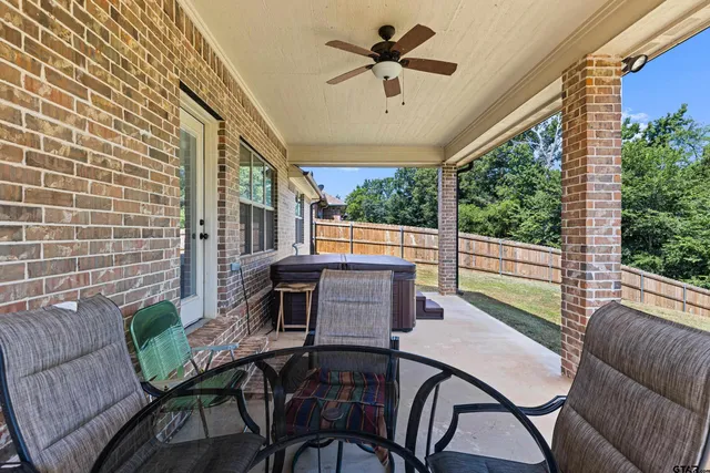 a big house with a big yard and large trees