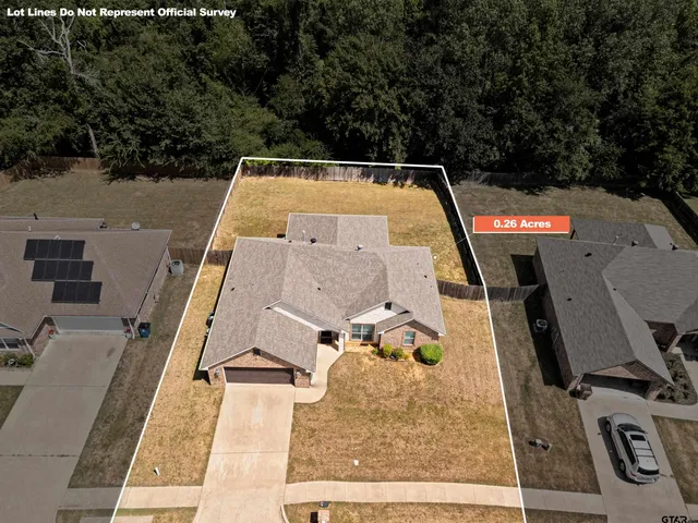 an aerial view of a house with a swimming pool