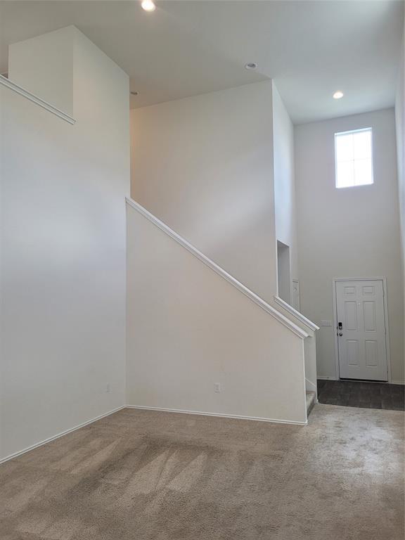 14917 Gypsum Mill Road Manor, TX 78653 - Photo 11 of 28 Enter into an airy entryway featuring soaring ceilings and bright overhead lighting.