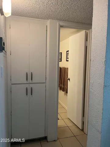 a bedroom with a bed and a television