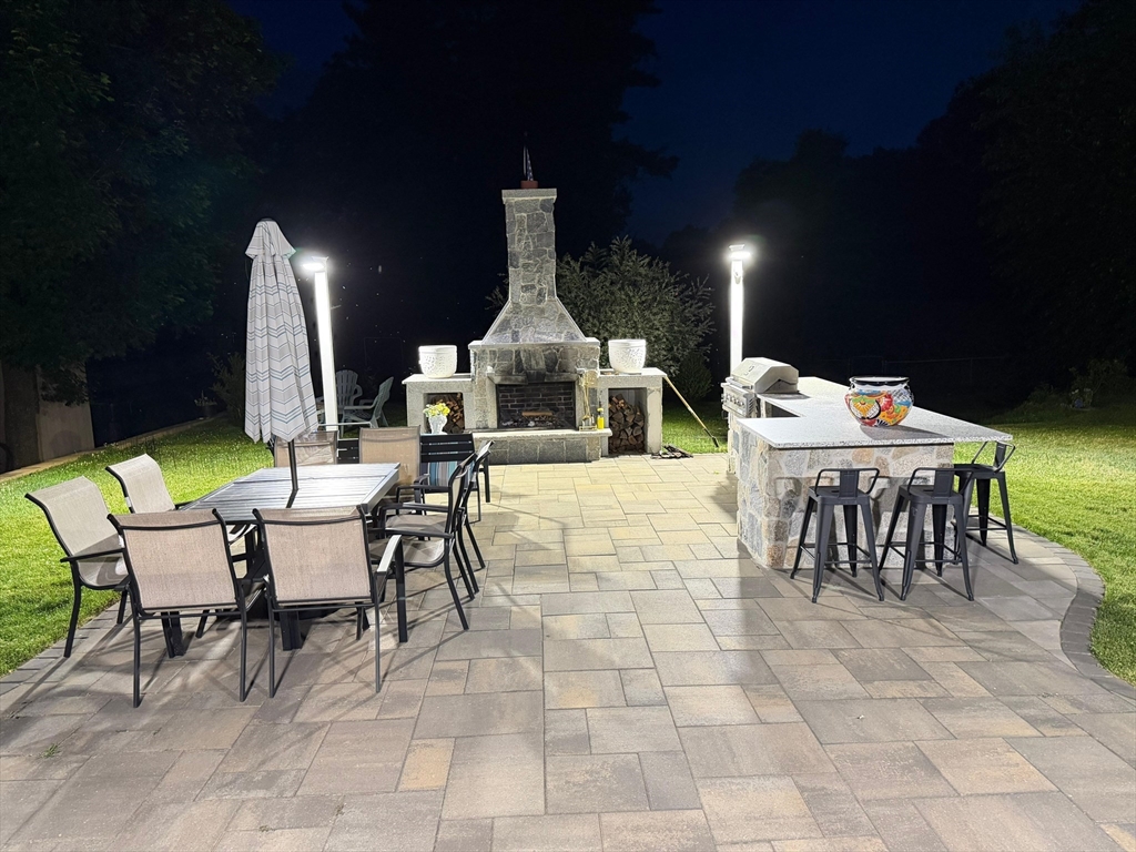 104 Southwest Cutoff Northborough, MA 01532 - Photo 33 of 33 a outdoor space with lots of tables a chairs and a fireplace
