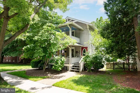 a view of a backyard with plants and a patio