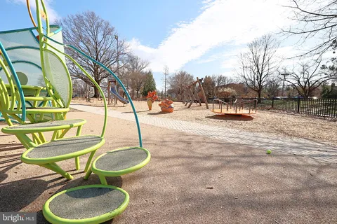 a view of a cars park in front of a building