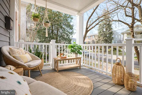 a view of a two chairs in the balcony