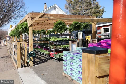 a front view of a residential houses with yard
