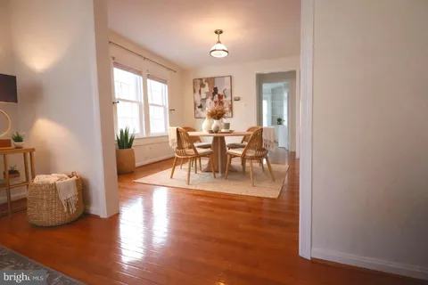 a view of a livingroom with furniture window and wooden floor