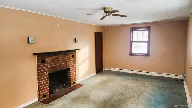 a view of room with window and ceiling fan