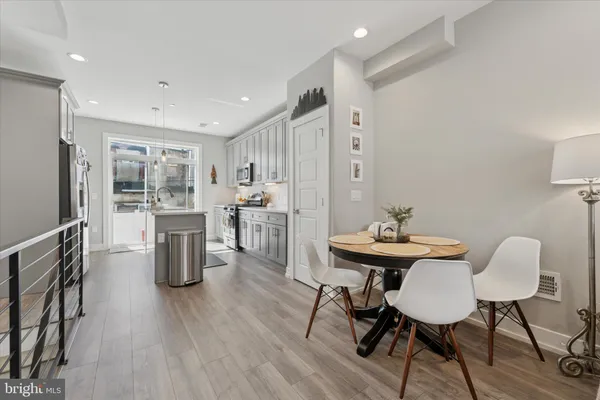 a workspace with furniture and wooden floor