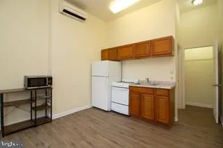 a view of a livingroom with furniture and wooden floor