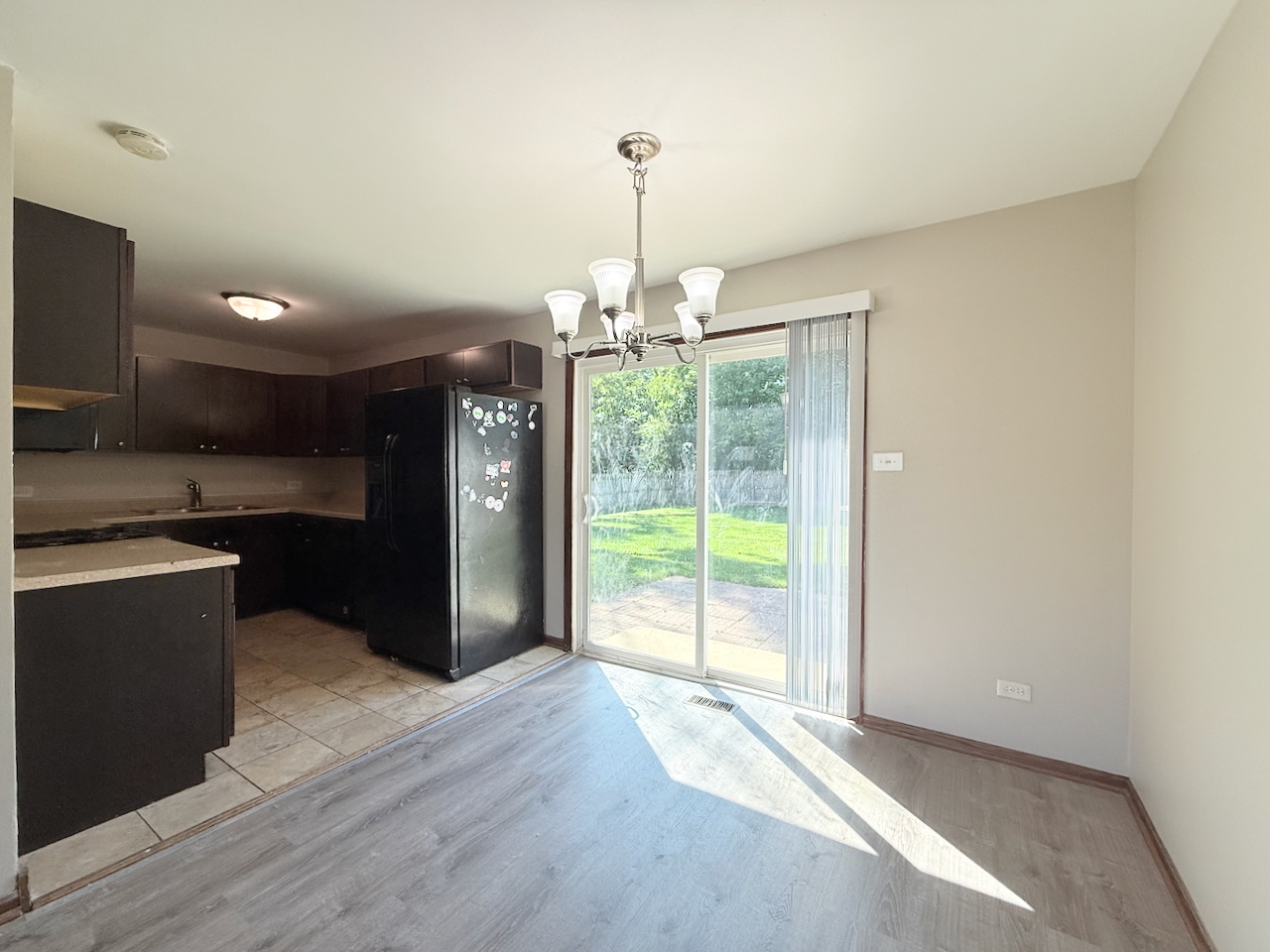 18018 Chantilly Lane Hazel Crest, IL 60429 - Photo 4 of 20 a view of an empty room with window and cabinet
