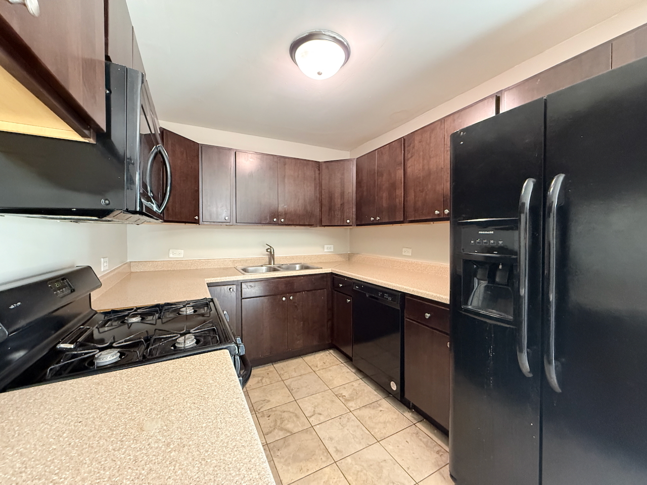18018 Chantilly Lane Hazel Crest, IL 60429 - Photo 5 of 20 a kitchen with stainless steel appliances granite countertop a refrigerator and a stove top oven
