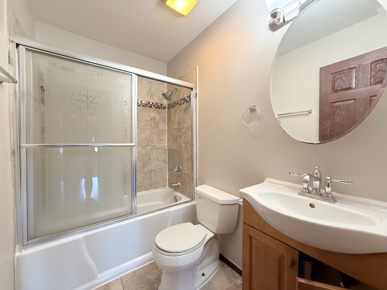 18018 Chantilly Lane Hazel Crest, IL 60429 - Photo 6 of 20 a bathroom with a sink toilet and shower