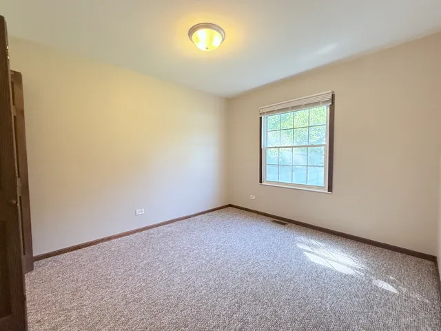 an empty room with closet area