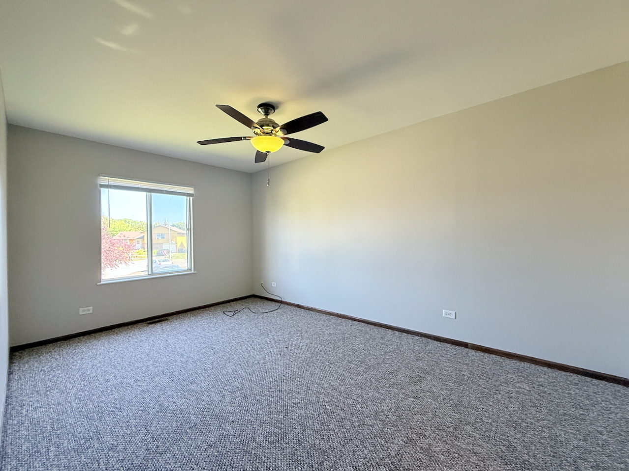18018 Chantilly Lane Hazel Crest, IL 60429 - Photo 9 of 20 an empty room with a window and a ceiling fan