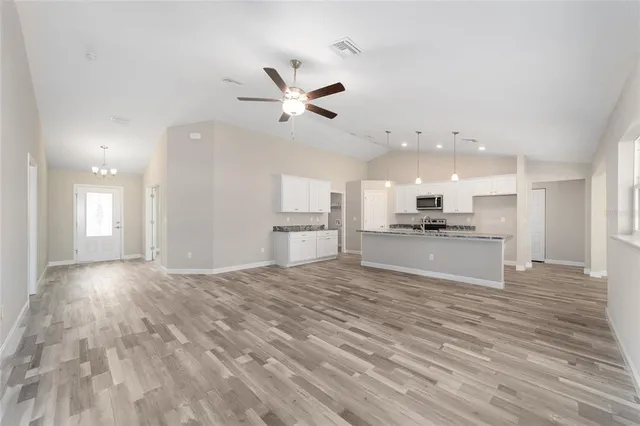 a view of kitchen with wooden floor and window