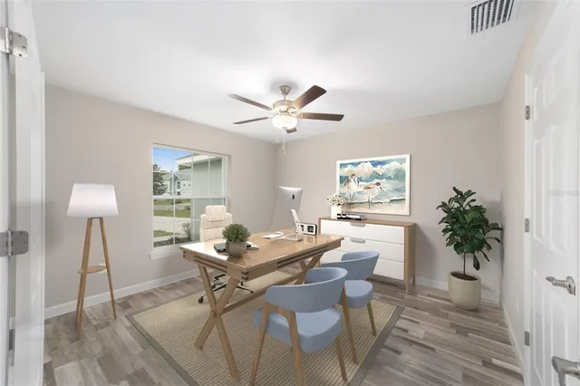 a workspace with furniture and a potted plant