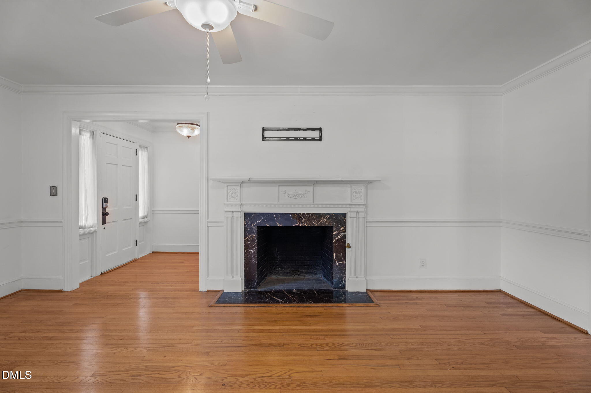 215 East Branch Street Spring Hope, NC 27882 - Photo 13 of 61 a view of empty room with wooden floor and fireplace