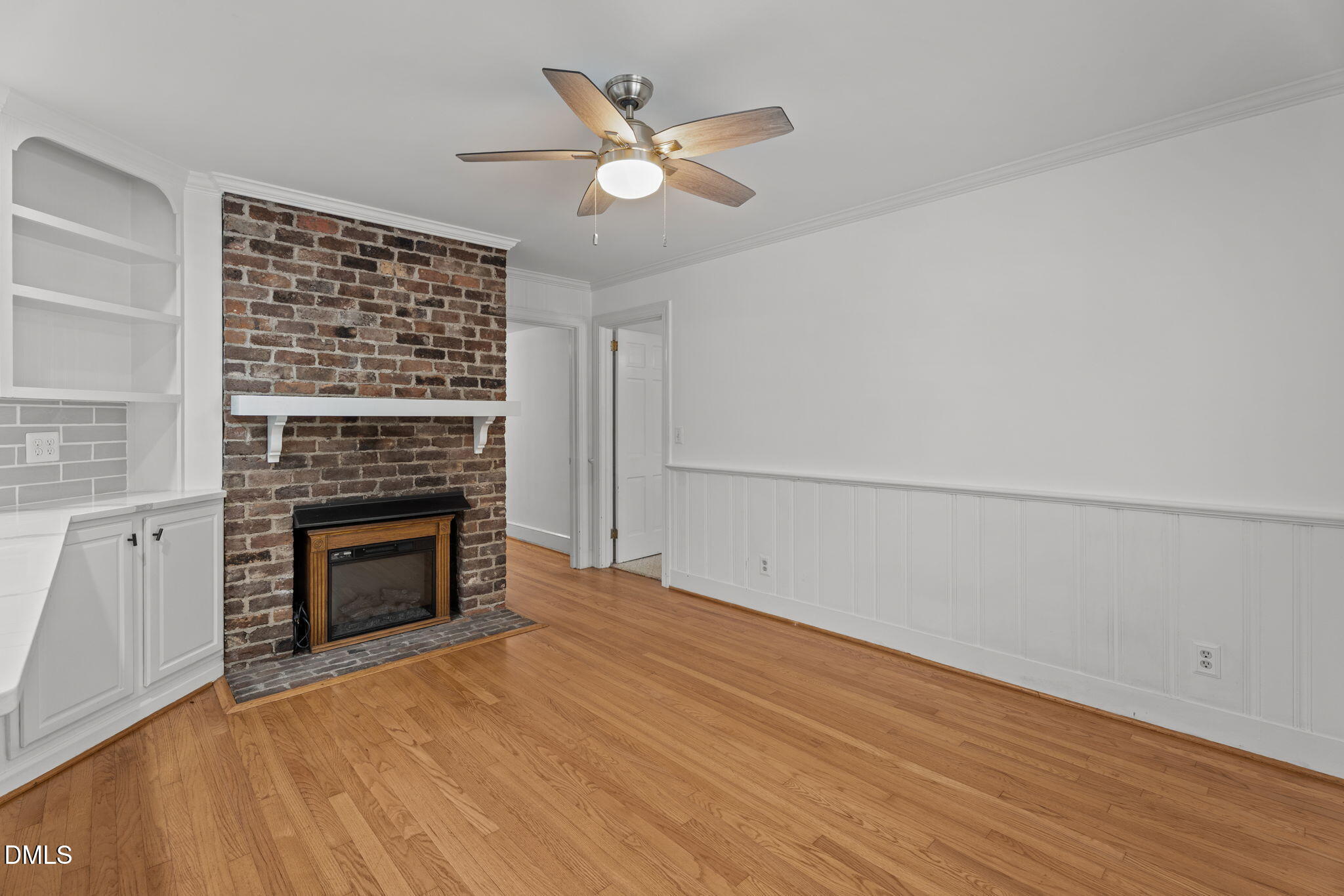 215 East Branch Street Spring Hope, NC 27882 - Photo 19 of 61 a view of empty room with a fireplace and wooden floor