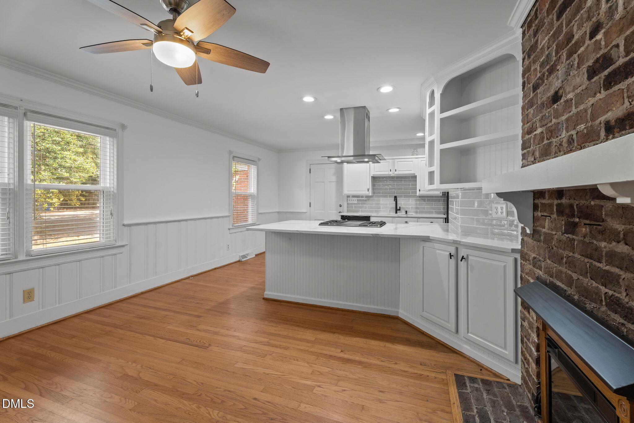 215 East Branch Street Spring Hope, NC 27882 - Photo 20 of 61 a kitchen with kitchen island a sink stainless steel appliances and cabinets