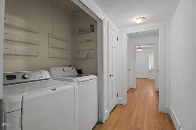 a bathroom with a sink vanity mirror and toilet