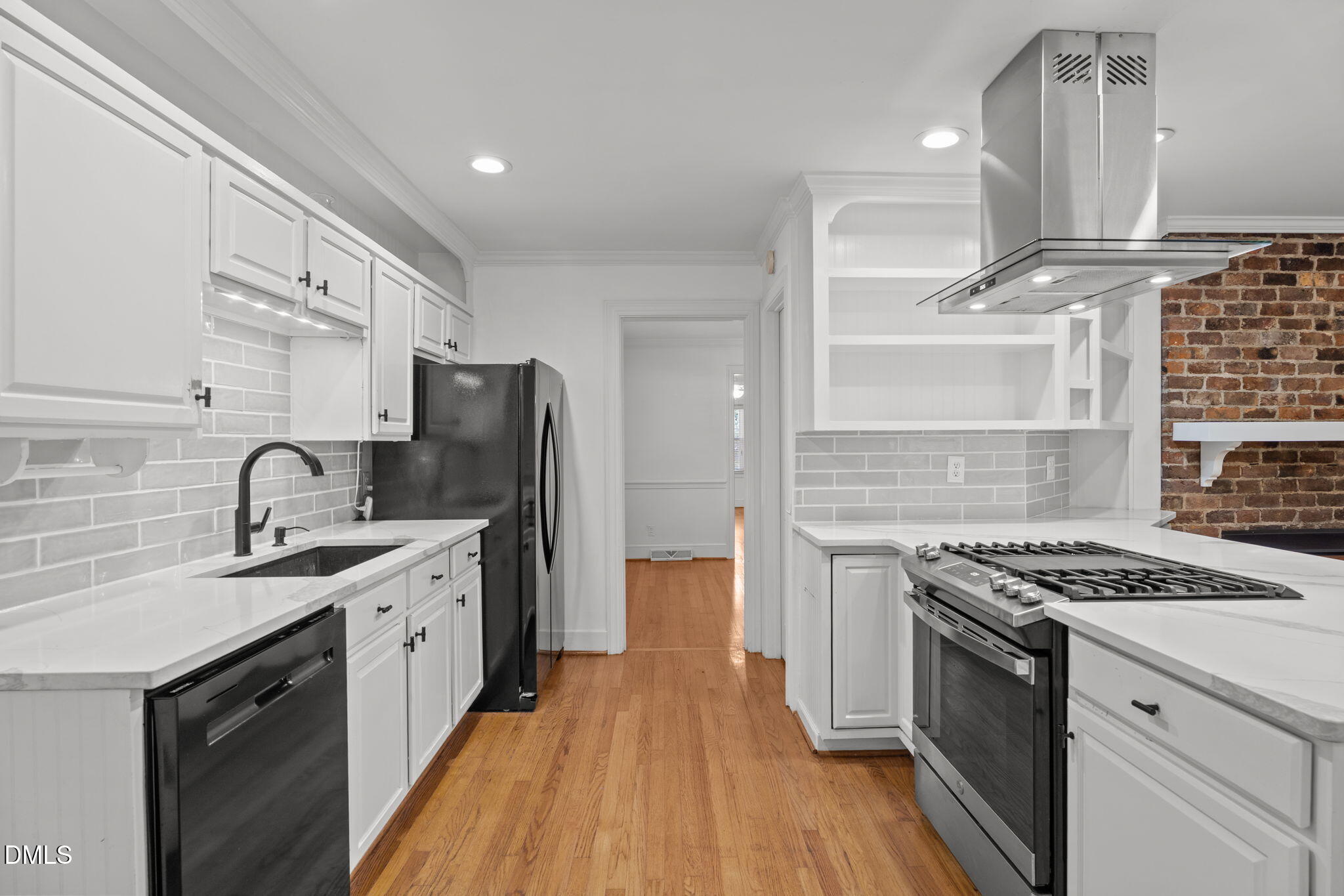 215 East Branch Street Spring Hope, NC 27882 - Photo 23 of 61 a kitchen with stainless steel appliances granite countertop a stove top oven a sink dishwasher and a refrigerator with wooden floor