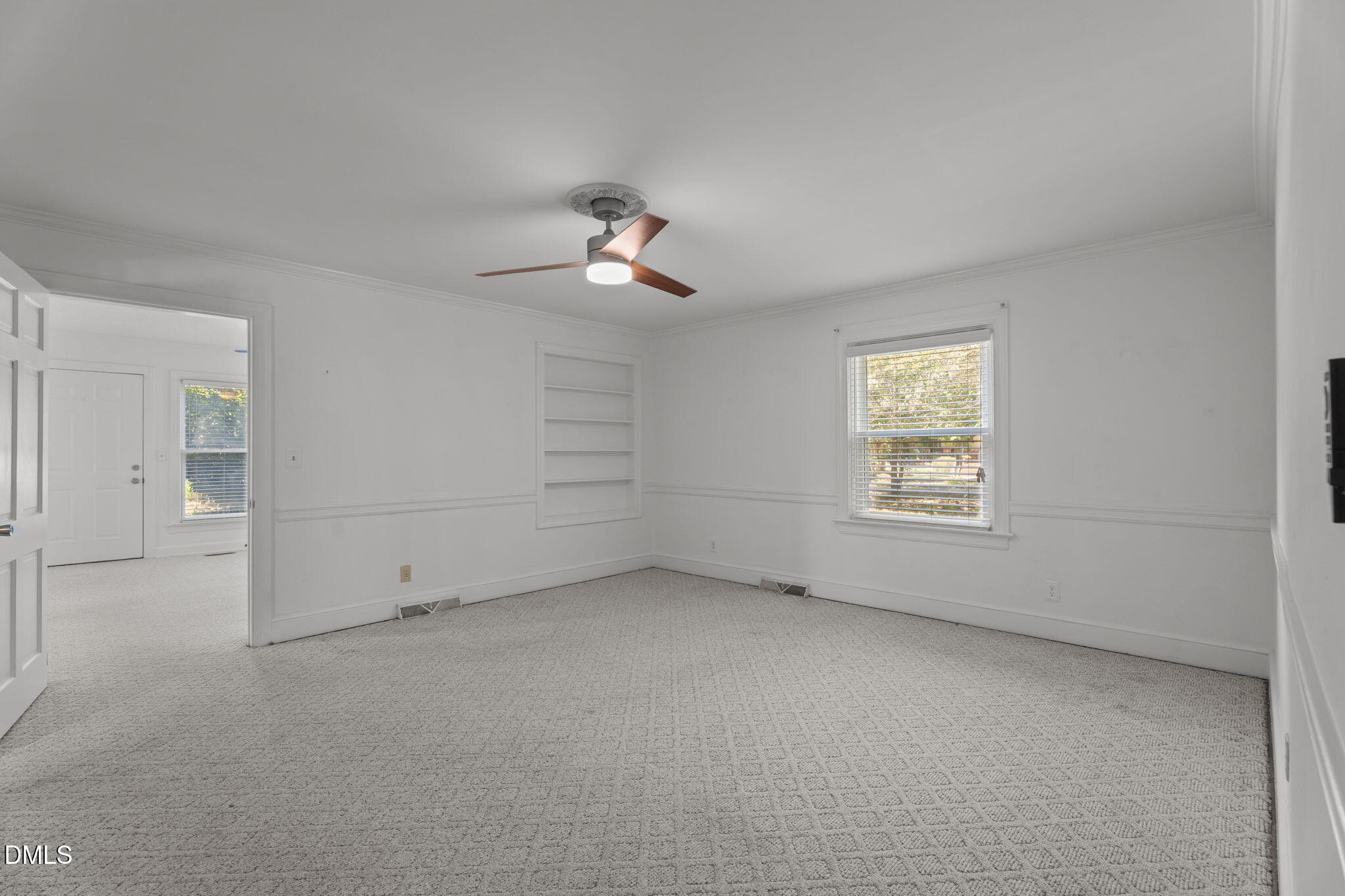 215 East Branch Street Spring Hope, NC 27882 - Photo 27 of 61 an empty room with a empty space and a ceiling fan