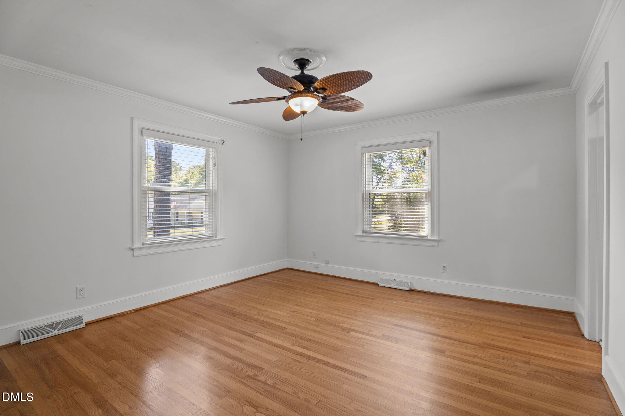 215 East Branch Street Spring Hope, NC 27882 - Photo 34 of 61 a view of an empty room with wooden floor and a window