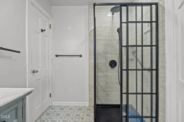 a view of a yard with plants and wooden fence