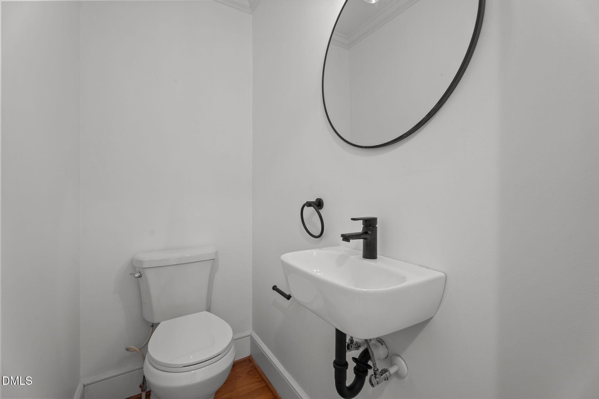 215 East Branch Street Spring Hope, NC 27882 - Photo 38 of 61 a bathroom with a toilet a sink and a mirror