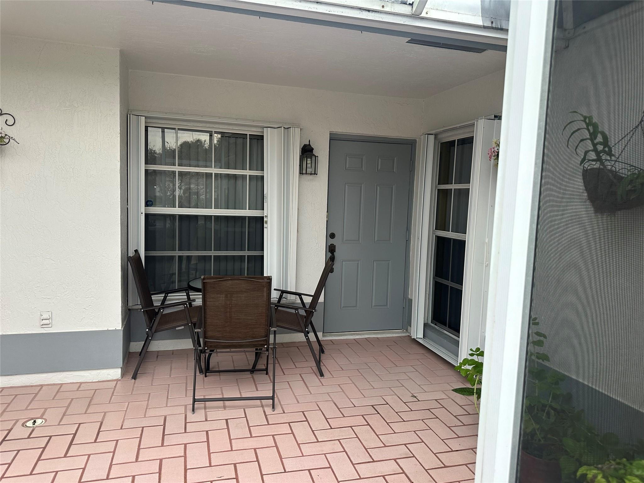 5912 Northwest 93rd Terrace Tamarac, FL 33321 - Photo 8 of 47 Front patio