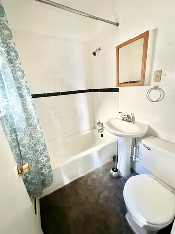 a bathroom with a sink toilet and a bathtub