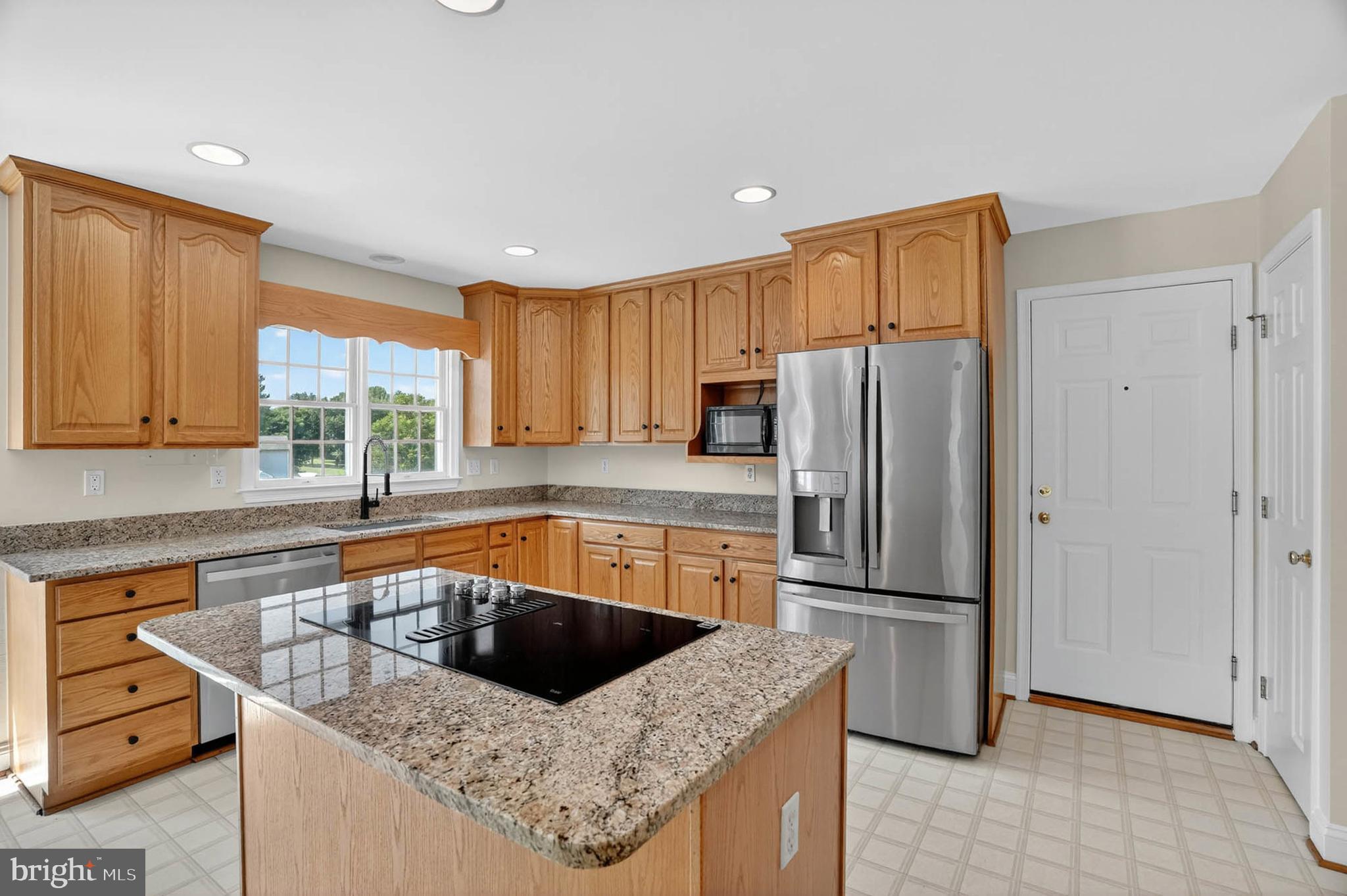 13215 Hunt Ridge Road Ellicott City, MD 21042 - Photo 8 of 53 Gormet Kitchen w/ new granite counters & cooktop
