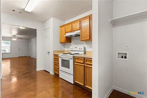 a kitchen with a refrigerator stove and a sink