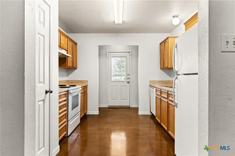 a view of a kitchen with kitchen and wooden floor