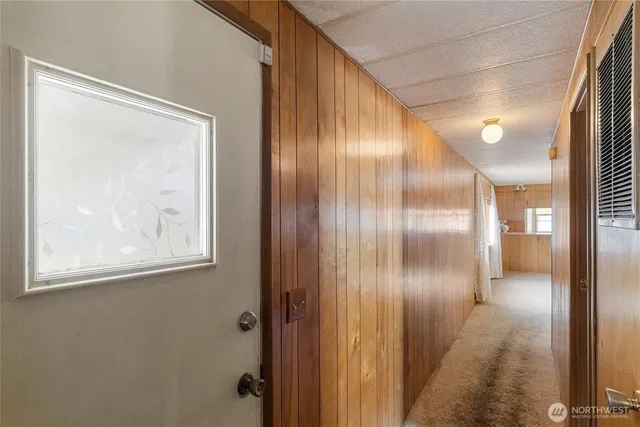 a bathroom with a glass shower door and a mirror