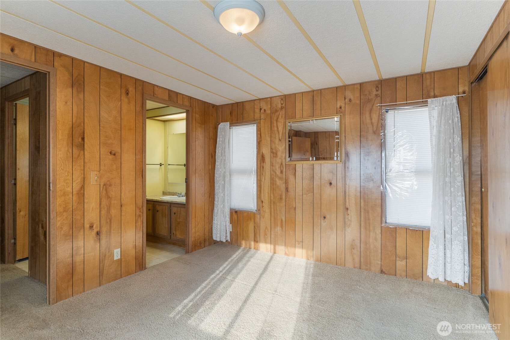 52 Engh Road, Unit 17B Omak, WA 98841 - Photo 17 of 27 a view of a bathroom with shower and windows