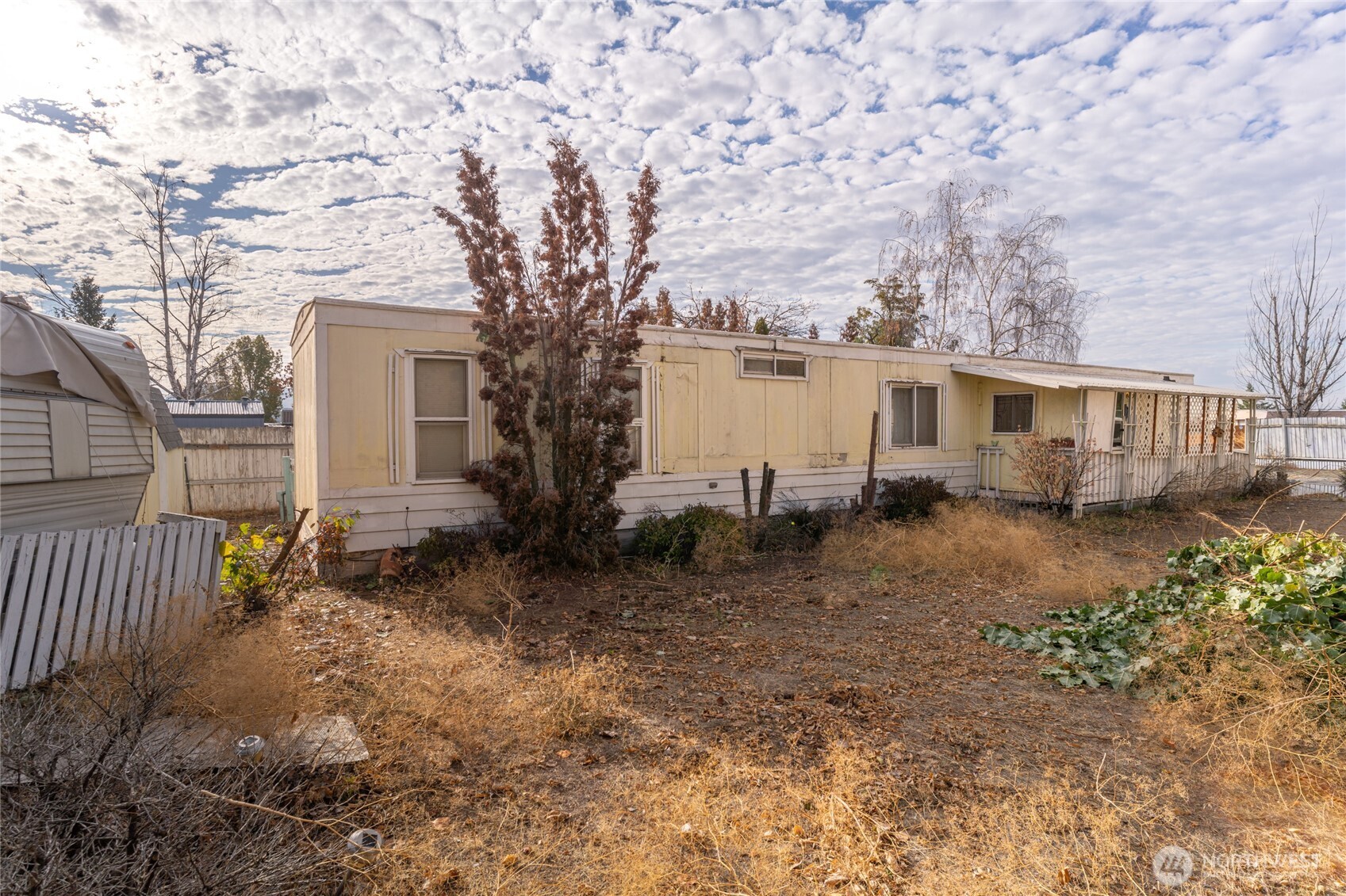52 Engh Road, Unit 17B Omak, WA 98841 - Photo 24 of 27 a view of a house with a yard