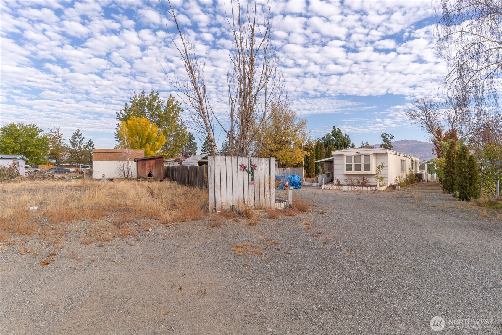 52 Engh Road, Unit 17B Omak, WA 98841 - Photo 27 of 27 a view of a street with a large trees