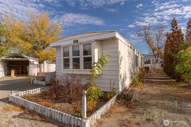 front view of a house with a tree
