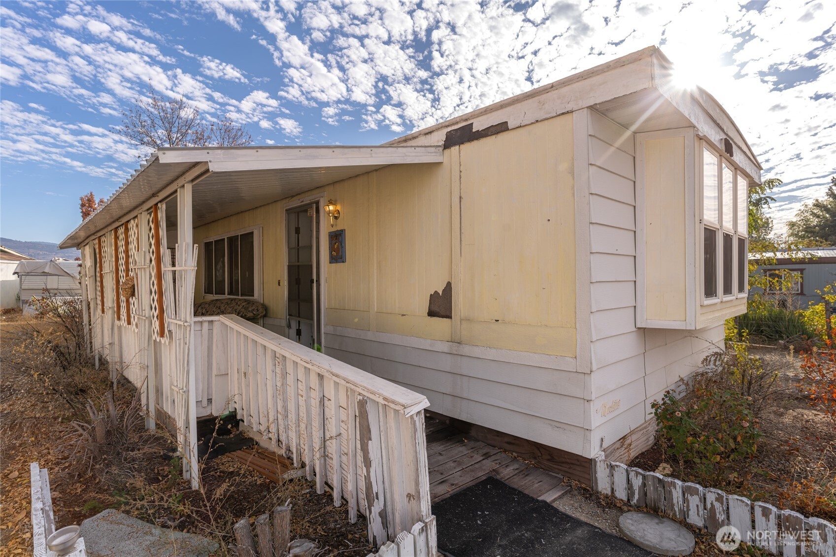 52 Engh Road, Unit 17B Omak, WA 98841 - Photo 5 of 27 a view of a house with a small yard