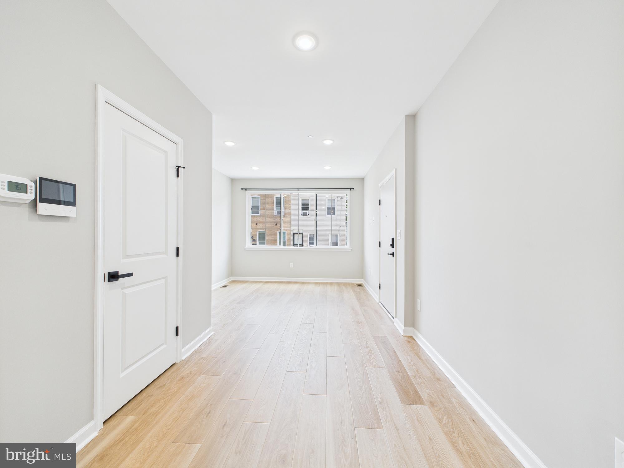 1320 Grove Street, Unit 1 Philadelphia, PA 19146 - Photo 13 of 15 a view of an empty room with a window