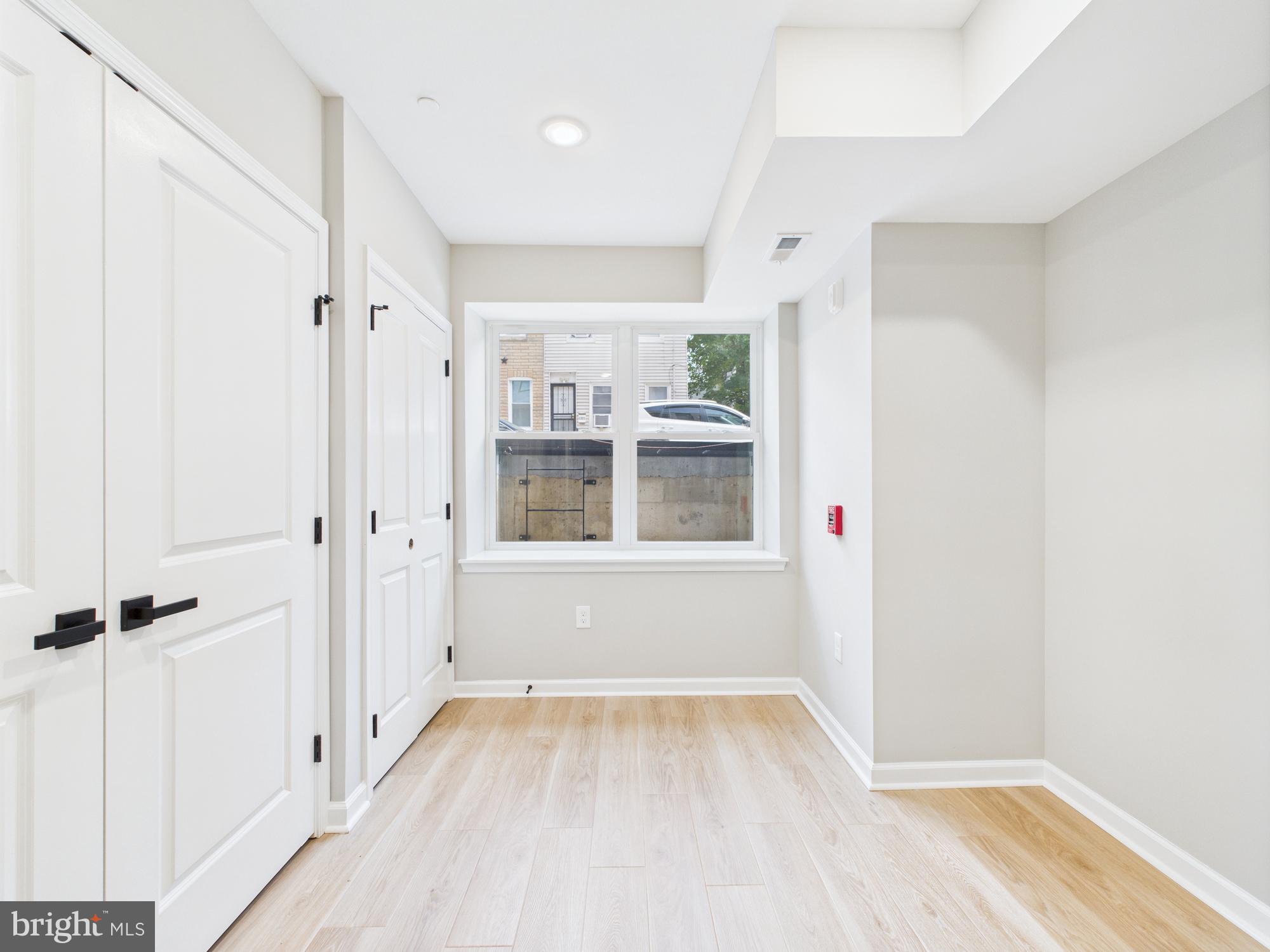 1320 Grove Street, Unit 1 Philadelphia, PA 19146 - Photo 8 of 15 wooden floor in an empty room