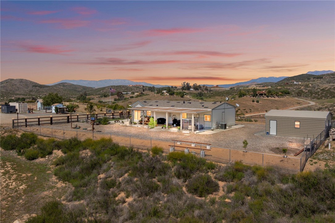 a view of a town with mountains in the background