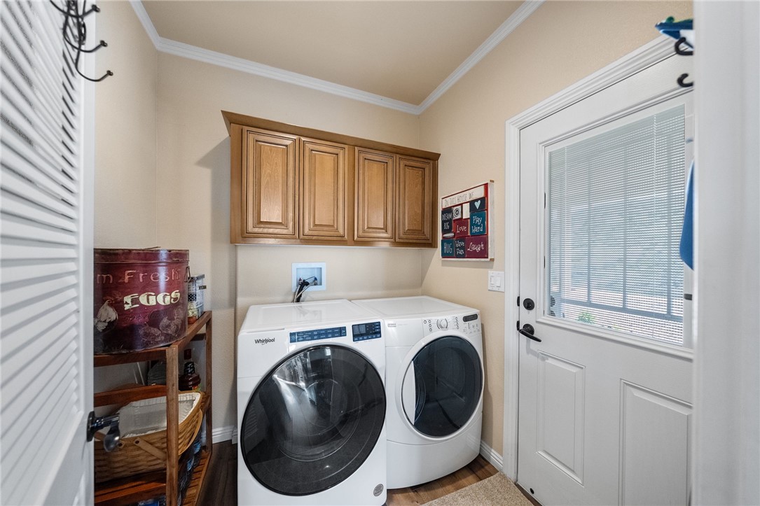 46430 De Portola Road Temecula, CA 92592 - Photo 16 of 61 a utility room with dryer washer and a window