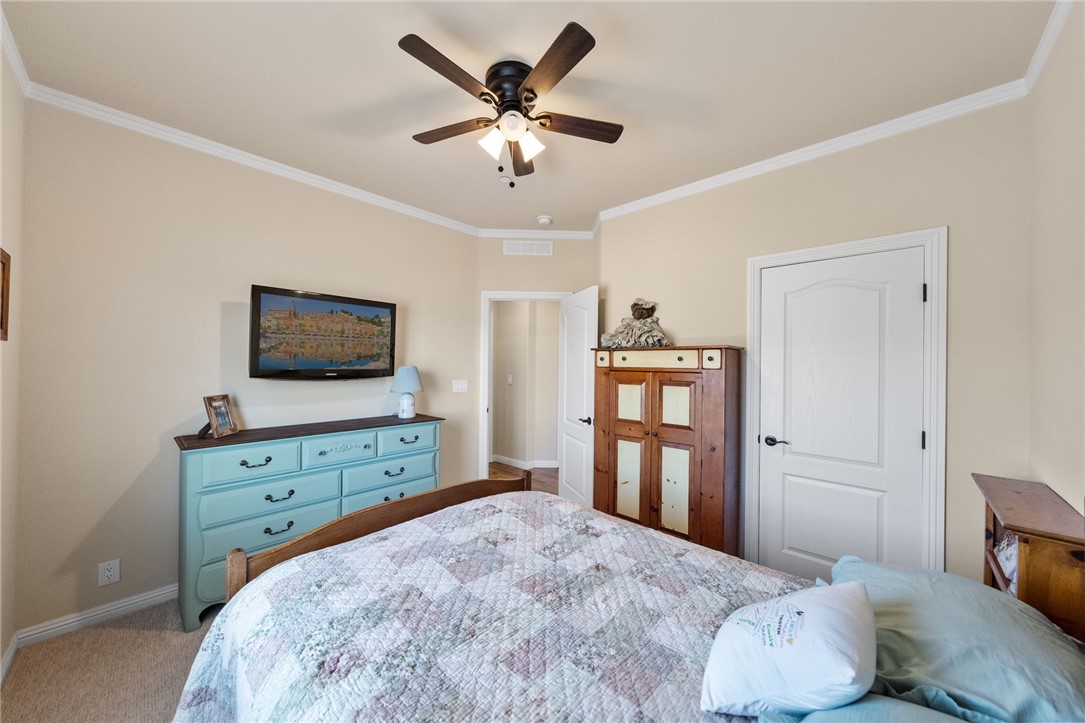 46430 De Portola Road Temecula, CA 92592 - Photo 20 of 61 a bedroom with a bed and a flat screen tv