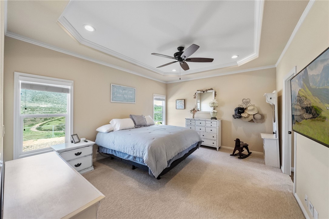 46430 De Portola Road Temecula, CA 92592 - Photo 21 of 61 a spacious bedroom with a bed and a large window
