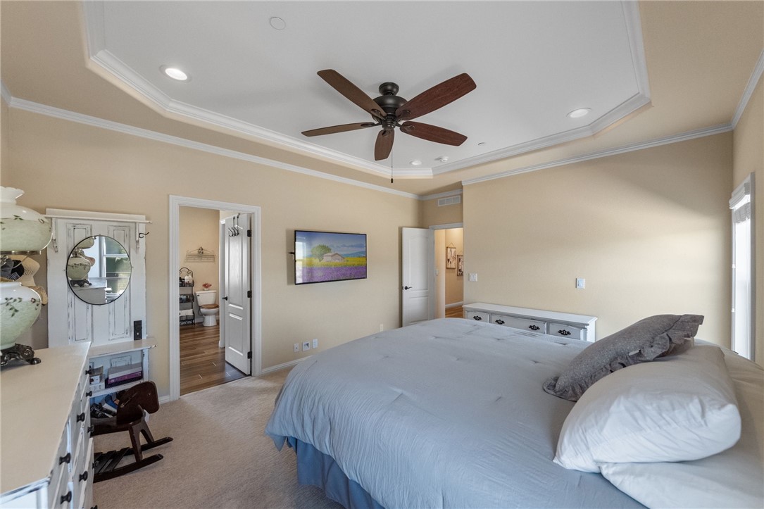 46430 De Portola Road Temecula, CA 92592 - Photo 22 of 61 a bedroom with a bed and a large mirror