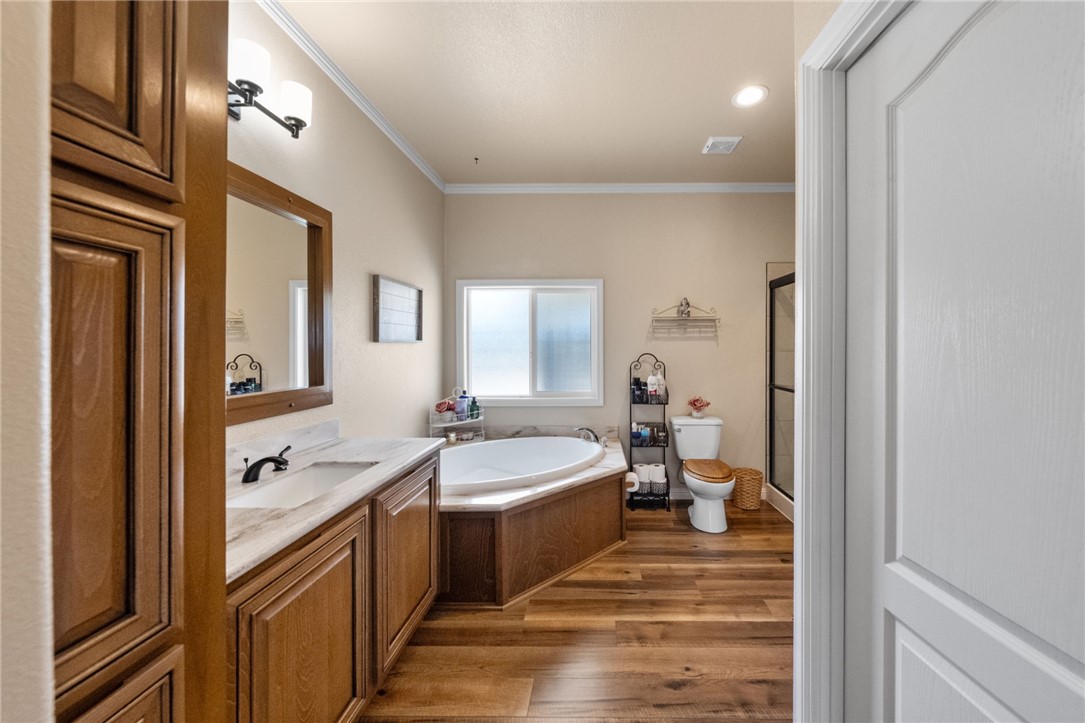 46430 De Portola Road Temecula, CA 92592 - Photo 23 of 61 a en suite bathroom with a double vanity sink a mirror and a shower