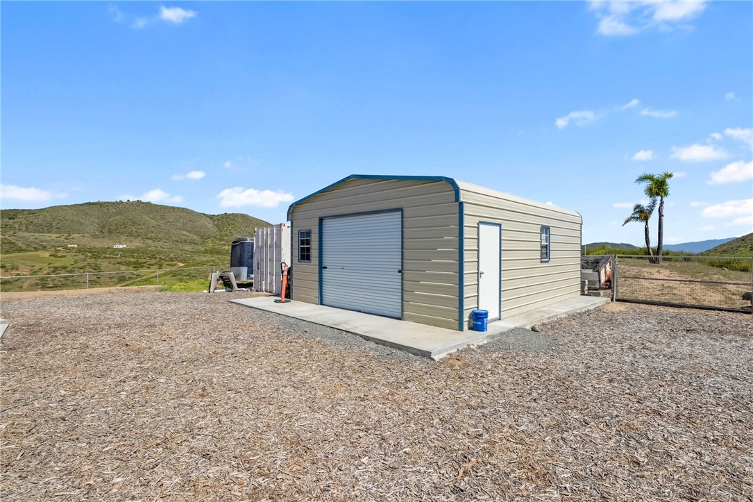46430 De Portola Road Temecula, CA 92592 - Photo 26 of 61 a view of a house with a yard